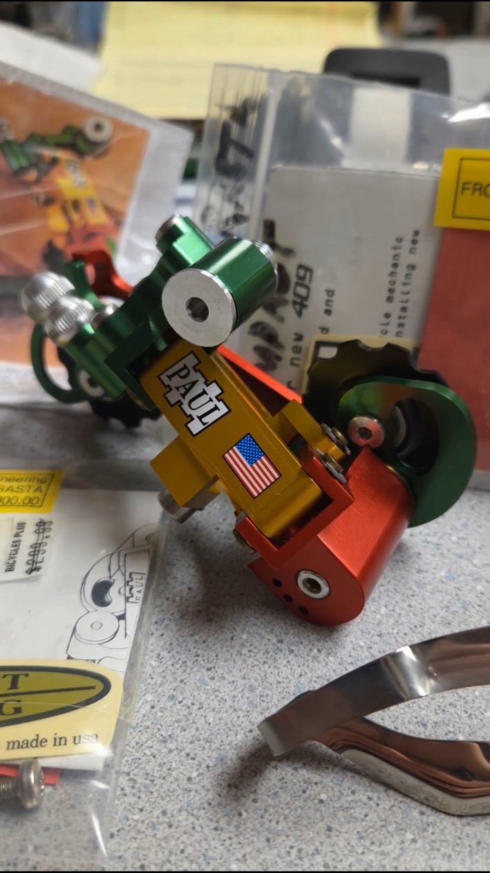 Colorful Paul Component Engineering rear derailleur on the service counter