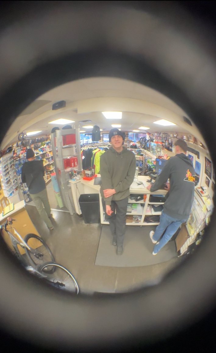 Wide-angle view of the Bicycles Plus shop interior at the front counter